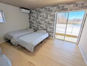Postel nebo postele na pokoji v ubytování Asuka Resort 富士山中湖