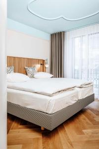 Una cama o camas en una habitación de Best Western Plus Hotel Bern