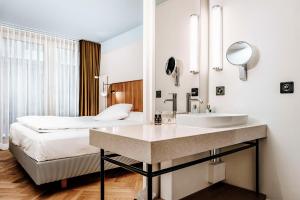 Una cama o camas en una habitación de Best Western Plus Hotel Bern