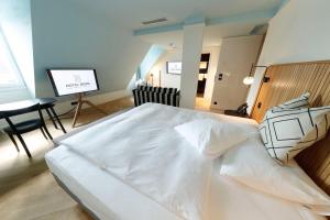 Una cama o camas en una habitación de Best Western Plus Hotel Bern
