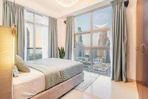 Ένα ή περισσότερα κρεβάτια σε δωμάτιο στο Luxury Condo with Full Marina view near beach