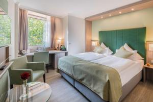 Postel nebo postele na pokoji v ubytování Best Western Plus Hotel Regence + 37 fotografií