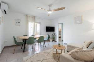 a living room with a couch and a table at Feel Welcome Barcelona 10 in Cornellà de Llobregat