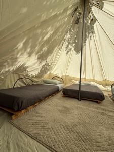 Postel nebo postele na pokoji v ubytování Glamping El Arbol - Naturaleza y Mar