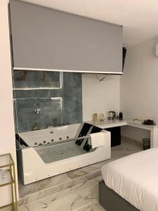 Ένα ή περισσότερα κρεβάτια σε δωμάτιο στο Bellini Luxury Suite Superior