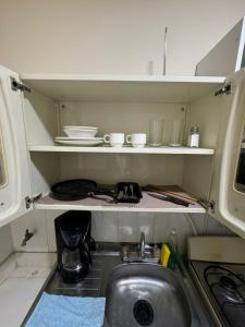 a small kitchen with a sink and a sink at Gaia in Medellín +56 photos