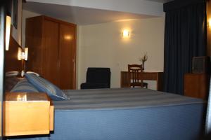 Cama ou camas em um quarto em Hotel das Taipas