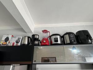 a shelf with a bunch of appliances sitting on it at P nacional do catimbau Buíque de 1 a 10 hospeder in Catimbau