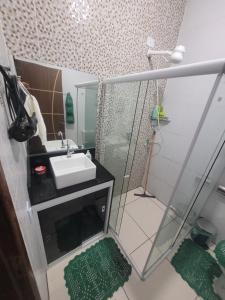 a small bathroom with a sink and a shower at P nacional do catimbau Buíque de 1 a 10 hospeder in Catimbau +24 photos