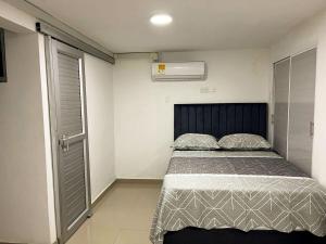 Postel nebo postele na pokoji v ubytování Acogedor y Moderno Apartamento en Barranquilla