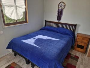 A bed or beds in a room at Oasis in the mountain, Quebrada Alvarado, Olmué