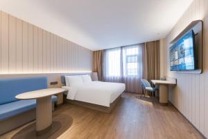 Vuode tai vuoteita majoituspaikassa Hanting Shanghai Pudong Airport Chuansha Road Hotel 汉庭上海浦东机场川沙路酒店