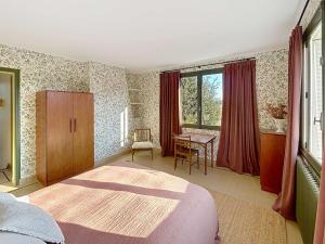 a bedroom with a bed and a desk in it at Maison d'exception à 80m de la plage avec accès direct, proche commerces, terrasse, BBQ, WiFi inclus - FR-1-361-375 in Jullouville-les-Pins