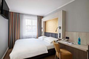 Postel nebo postele na pokoji v ubytování Best Western Raphael Hotel Altona