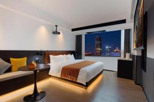 Voodi või voodid majutusasutuse Mcsrh Hotel-Hangzhou Xihu toas
