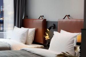 Voodi või voodid majutusasutuse Mcsrh Hotel-Hangzhou Xihu toas