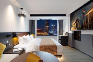 Voodi või voodid majutusasutuse Mcsrh Hotel-Hangzhou Xihu toas