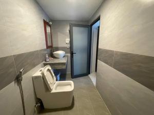 a bathroom with a toilet and a sink at Moc homestay- Near Bai Dai Beach in Cam Lâm +74 photos