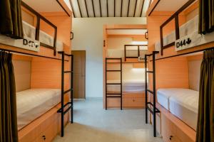 a room with bunk beds in a hostel at Wanaseta Guesthouse in Uluwatu +13 photos