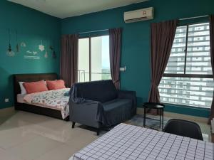 a bedroom with a bed and a chair at Escape by SM Retreats in Cyberjaya +37 photos