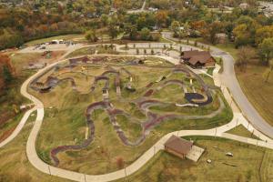 an aerial view of a park with a race track at Family Fun! Sleeps 8, King Bed, 2 Queens, and Sofa Bed, Games - in Rogers in Rogers