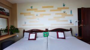 Postel nebo postele na pokoji v ubytování NEST House
