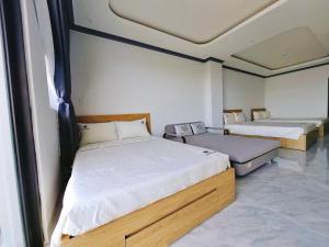 Postel nebo postele na pokoji v ubytování Phuong Linh Hotel - Ninh Thuận