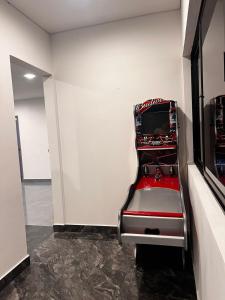 a red seat in a room with a wall at Quinta Emmanuel in Guaduas +19 photos