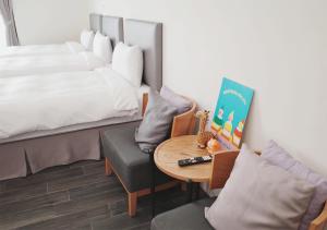 Ένα ή περισσότερα κρεβάτια σε δωμάτιο στο Happy Guesthouse