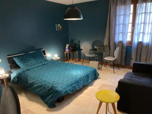 Postel nebo postele na pokoji v ubytování Chambre dans anciennes écuries