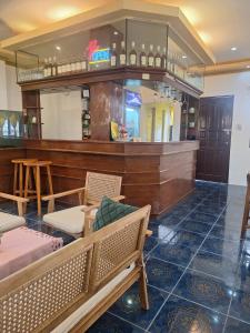 a bar with chairs and a bench in a room at Japitan Waterfront Resort in Dolores +36 photos