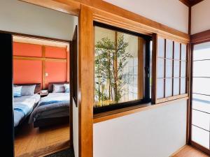 加美屋リゾート 秩父 庭日和-Kamiya Resort Chichibu Niwabiyoriにあるベッド