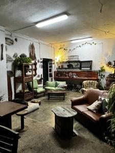 a living room with a couch and a table at Vuelve al Origen - Nómadas Digitales in Tegueste