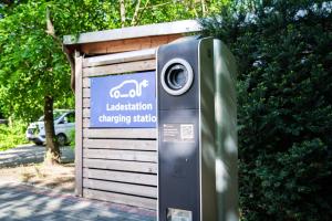 a parking meter in front of a garage at Best Western Hotel Windorf in Leipzig