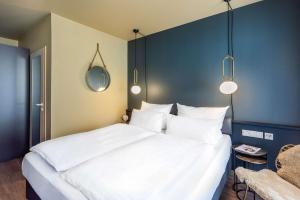 Postel nebo postele na pokoji v ubytování Best Western Hotel Nürnberg am Hauptbahnhof