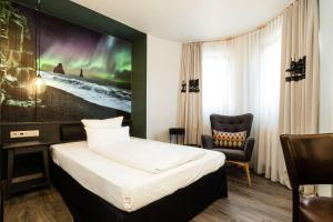 Postel nebo postele na pokoji v ubytování Best Western Hotel Nürnberg am Hauptbahnhof