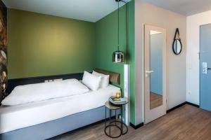 Postel nebo postele na pokoji v ubytování Best Western Hotel Nürnberg am Hauptbahnhof