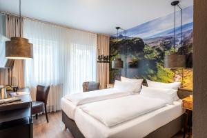Postel nebo postele na pokoji v ubytování Best Western Hotel Nürnberg am Hauptbahnhof