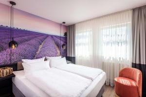 Postel nebo postele na pokoji v ubytování Best Western Hotel Nürnberg am Hauptbahnhof