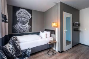 Postel nebo postele na pokoji v ubytování Best Western Hotel Nürnberg am Hauptbahnhof