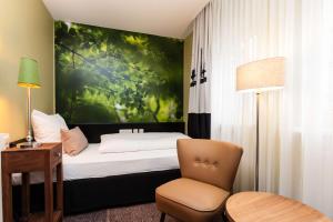 Postel nebo postele na pokoji v ubytování Best Western Hotel Nürnberg am Hauptbahnhof