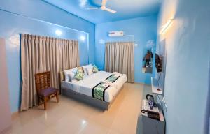 Ένα ή περισσότερα κρεβάτια σε δωμάτιο στο Atithi inn Guest House