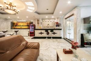 a living room with a couch and a table at A25 Hotel - 221 Bạch Mai in Hanoi