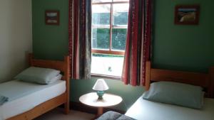 Katil atau katil-katil dalam bilik di The Innlet, Country Apartments and Cottages