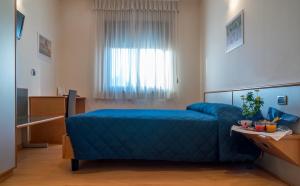 Postelja oz. postelje v sobi nastanitve Sam Hotel