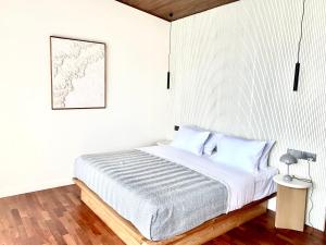 Postel nebo postele na pokoji v ubytování COVE VILLAS Mandalika
