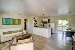 a living room with a couch and a table at Crane's Beach House Boutique Hotel & Luxury Villas in Delray Beach