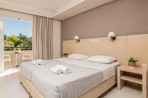 Postel nebo postele na pokoji v ubytování Karras Hotel + 37 fotografií