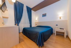 Postelja oz. postelje v sobi nastanitve Sam Hotel