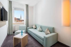 TV a/nebo společenská místnost v ubytování Best Western Hotel Lamm